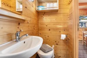 a bathroom with a sink and a toilet at Marina Zernsdorf in Zernsdorf +106 photos