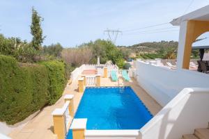 a pool on the side of a house at Villa Casablanca Apartment in Torrent