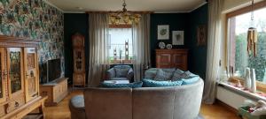 a living room with a couch and a tv at Fewo Haus Cäcilia in Elsdorf