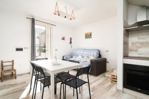 a kitchen and living room with a table and chairs at Tasa tiago in Santa Lucia +21 photos