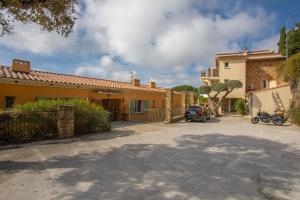 a car is parked in front of a house at Le Mas Berliat N°7 in Bormes-les-Mimosas +20 photos