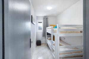 a room with two bunk beds and a door at Cal Jaume in Masquefa +23 photos