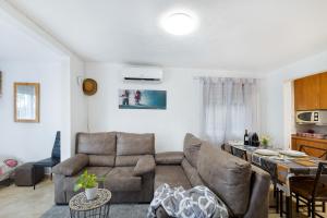 a living room with a couch and a table at Cal Jaume in Masquefa