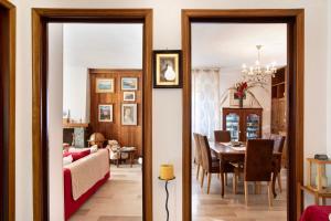 a living room and dining room with a dining table at Vanna House in Saint Vincent