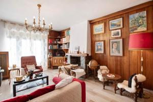 a living room with a couch and a fireplace at Vanna House in Saint Vincent