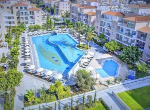 an aerial view of a swimming pool in a resort at Stunning Sea View Resort Pools Spa Gym Balcony in Paphos
