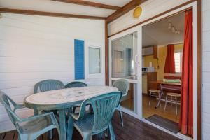 a dining room with a table and chairs at Bungalow D in Pontevedra