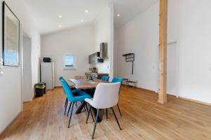 a kitchen and dining room with a table and chairs at White House Apartments in Kappel-Grafenhausen