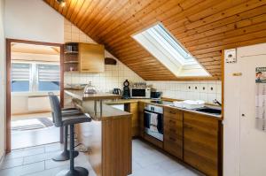 a kitchen with a skylight and a counter top at Fewo Georg in Pfullendorf