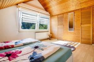 a bedroom with a bed in a room with a window at Fewo Georg in Pfullendorf