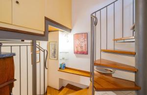 a staircase in a house with wooden floors at Casina La Torretta - By The Walls in Lucca