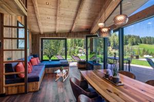 a living room with a couch and a table at Chalet Ski in Selva di Val Gardena