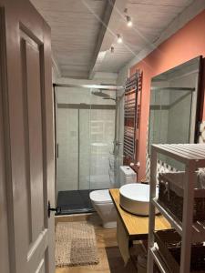 a bathroom with a toilet and a sink at Casa Eider in Rucandio +17 photos