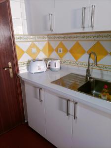 a kitchen with a sink and a counter top at Valley T2 duplex in Vila Nova de Foz Coa