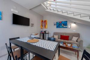 a living room with a table and a couch at Meravigliosalento in Squinzano