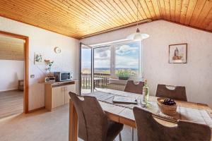 a dining room with a table and a view of the ocean at Kirschenhof in Bad Bellingen