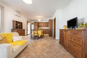 a living room with a couch and a tv at Girasole in Pula