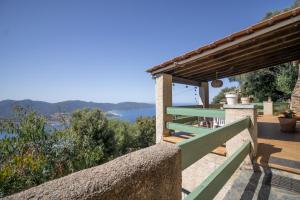 a house with a view of the ocean at Mon nid d'aigle in Olmeto