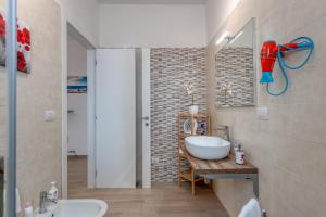 a bathroom with a sink and a mirror at Meravigliosalento in Squinzano +43 photos