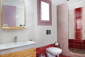 a bathroom with a toilet and a sink and a shower at Nicolas House 1 in Rakhídhion