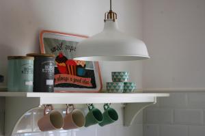 a light hanging over a shelf in a kitchen at Son Pelai Menut in Lloseta +29 photos