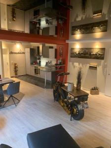 a living room with a motorcycle parked in the middle at Gemütliche Wohnung in Ortsrandlage in Rüdesheim am Rhein
