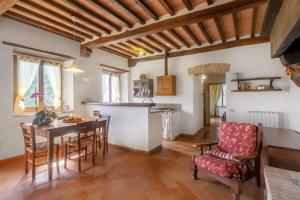 a kitchen and dining room with a table and chairs at Universal Harmony - Usignolo in Dicomano