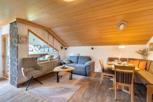 a living room with a couch and a table at Haus Seiler in Freudenstadt