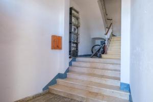 a staircase in a house with a bike on the wall at Apartamento las Palmeras 1 in Benicarló