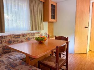 a kitchen with a table with a bowl of fruit on it at Le sorgenti - Mobile Home 46 in Palazzuolo sul Senio +33 photos