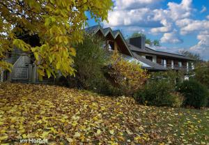 a pile of leaves in front of a house at Fewo Eitermoser Afrikanischer Traum in Pfaffing