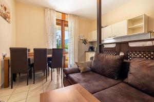 a living room with a couch and a table at Appartamento Alexander in Tignale