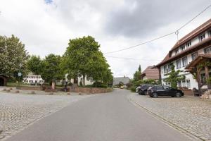 a street with cars parked on the side of a road at Auszeit in Donaueschingen