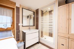 a bathroom with a toilet and a sink and a shower at La source in Brides-les-Bains +17 photos