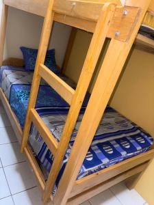 a wooden bunk bed in a room at La Lagartija Iquitos in Iquitos +55 photos