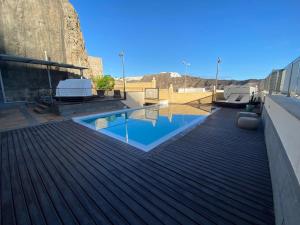 a swimming pool on the roof of a building at Villa Happy Dreamer in Puerto Rico de Gran Canaria