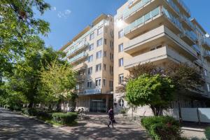 a person walking in front of a building at PrimeStayBudapest in Budapest