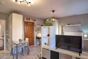 a living room with a large flat screen tv at Casa Curro en Baena in Baena +8 photos