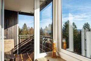 a screened in porch with a fire hydrant next to a window at Wohnung Fuchsenstein-Foxy in Spiegelau