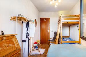 a bedroom with a bunk bed and a desk at Wohnung Fuchsenstein-Foxy in Spiegelau +19 photos