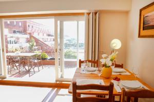 a dining room with a table and a large window at Bahia Sea View Apartment in Caminha