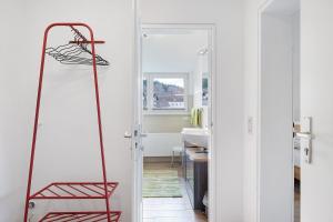 a red basketball hoop in a bathroom with a sink at Ferienwohnung Eulennestle in Lenzkirch