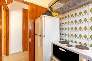a kitchen with a refrigerator and a stove at Mires House Apartment 11 in Agios Gordios
