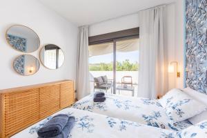 a bedroom with a bed and a window with a view at Golf Beach Vera in Vera