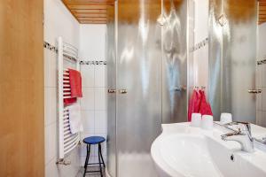 a bathroom with a sink and a shower at Willmannshof in Furtwangen +69 photos