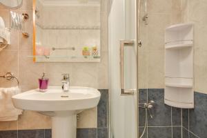 a bathroom with a sink and a shower at Casa Paco in Mogán +12 photos