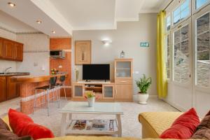 a living room with a couch and a table at Casa Paco in Mogán