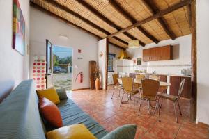 a living room with a couch and a table at Quinta da Amendoeira in Foz