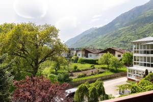a view from the balcony of a house with mountains in the background at Mayr Apartments sechs in Plaus