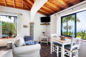 a living room with a white couch and a table at Las Vetas in Tijarafe